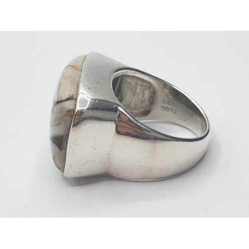 311 - Silver ring having a large cream and brown zebra Jasper stone in rectangular form to top. Clear mark... 