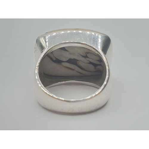 311 - Silver ring having a large cream and brown zebra Jasper stone in rectangular form to top. Clear mark... 