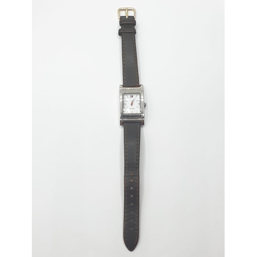 319 - Ladies wristwatch for sale. White face model with square stainless steel case. Brown leather strap. ... 