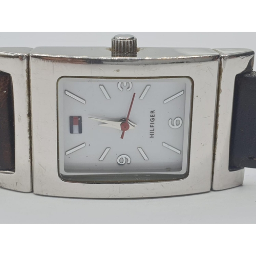 319 - Ladies wristwatch for sale. White face model with square stainless steel case. Brown leather strap. ... 