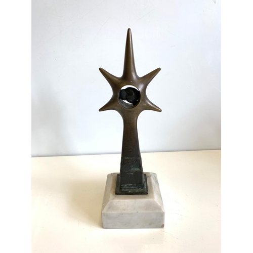 531 - Brass Ornament with a Phoetus in a Star Sculpture on Marble Plinth, 30cms Tall, 10x10cm Base.