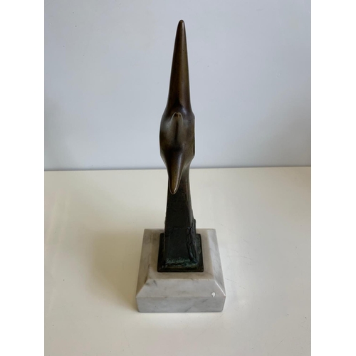 531 - Brass Ornament with a Phoetus in a Star Sculpture on Marble Plinth, 30cms Tall, 10x10cm Base.