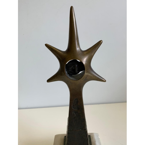 531 - Brass Ornament with a Phoetus in a Star Sculpture on Marble Plinth, 30cms Tall, 10x10cm Base.