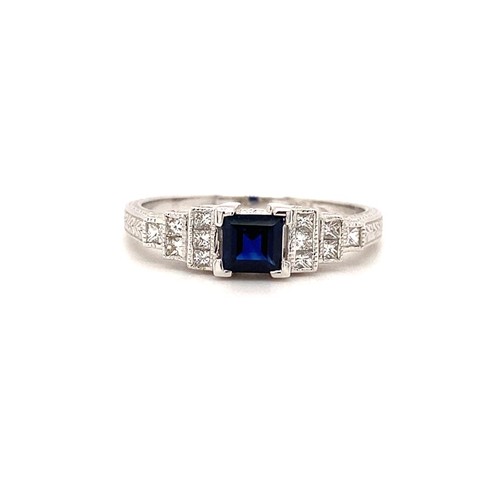 605 - 18k white gold ring with 0.35ct blue sapphire centre and 0.18cts diamonds on shoulders,  size M1/2