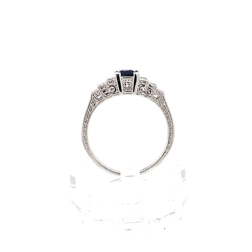 605 - 18k white gold ring with 0.35ct blue sapphire centre and 0.18cts diamonds on shoulders,  size M1/2