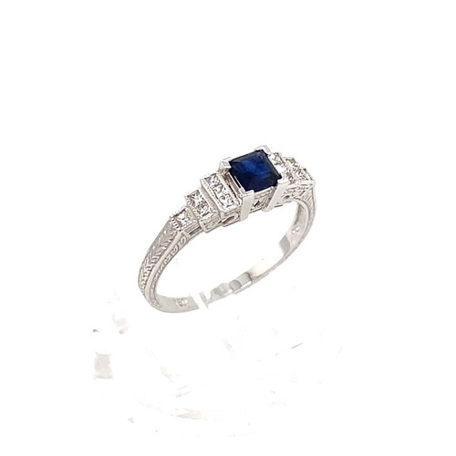 605 - 18k white gold ring with 0.35ct blue sapphire centre and 0.18cts diamonds on shoulders,  size M1/2