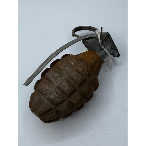 117 - WW2 INERT US Pineapple Grenade with a dummy fuze. The fuze is sprung and with release the level when... 