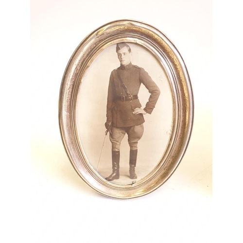 221 - Royal flying corps officers side cap, 1915 hallmarked silver framed photograph, bronze and cloth pil... 