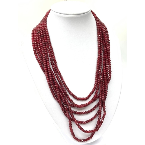 15 - An impressive seven row multi-faceted ruby necklace, Length 44-60cm
Weight: 106 g. Rubies are colour... 