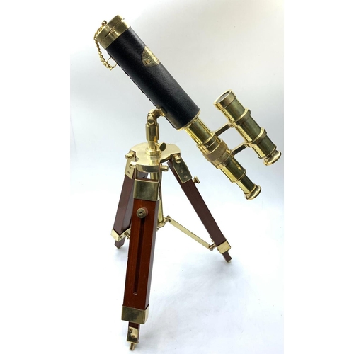 28 - A highly ornamental, modern, brass, replica of an Edwardian telescope,
on a mahogany and brass adjus... 