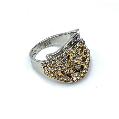 32 - A boxed silver and gold ring (stamped 925 and 750) with sapphires representing 
two overlapping leav... 