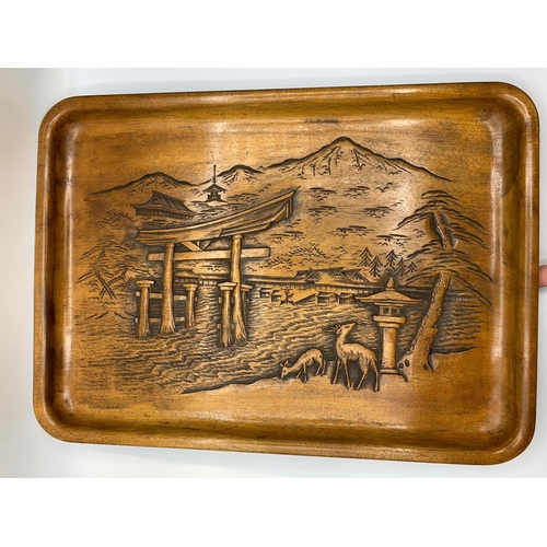 38 - A wooden tray with relief carving of Itsukushima Shinto Shrine in Japan.            
It depicts the ... 