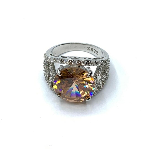 61 - A beautiful, silver (stamped S9250) ring with a large central stone (morganite?)
and surrounding sap... 