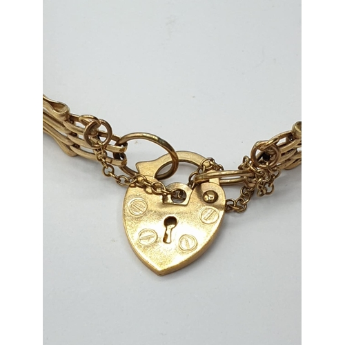 140 - 9ct gate BRACELET with heart padlock.  4.9g. 16cm.