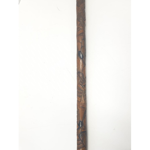 12 - An early Japanese BAMBOO WALKING STICK.  Hand carved with inlaid bone.  Signed by maker.