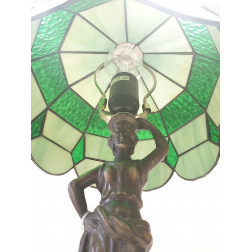 145 - Tiffany style LAMP. Lady  holding torch stem. Metal base.