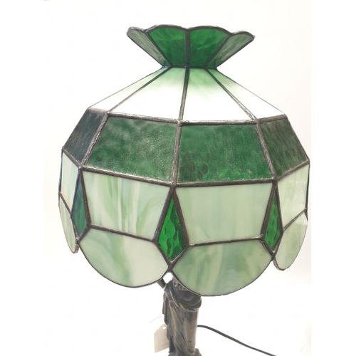 145 - Tiffany style LAMP. Lady  holding torch stem. Metal base.