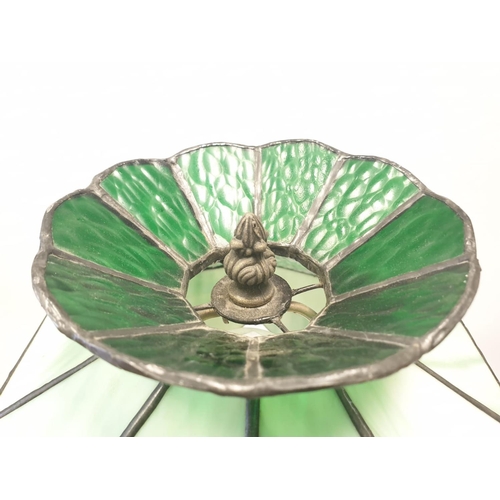 145 - Tiffany style LAMP. Lady  holding torch stem. Metal base.