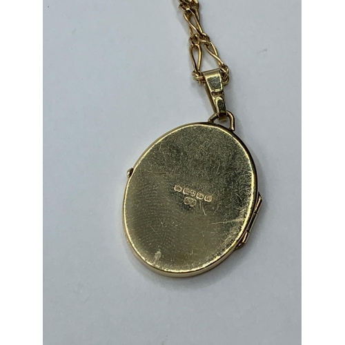 62 - 9CT YELLOW GOLD OVAL LOCKET AND CHAIN