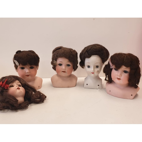 813 - Five Bisque Porcelain Dolls Heads 4 of which have Embossed German Marks.