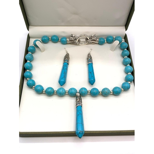 147 - A Tibetan turquoise style necklace and earrings set in a presentation box.
Necklace clasp in the sha... 