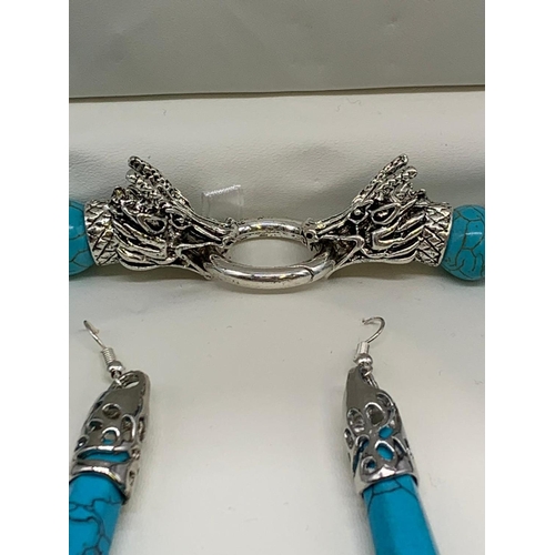 147 - A Tibetan turquoise style necklace and earrings set in a presentation box.
Necklace clasp in the sha... 