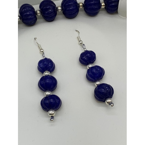 28 - A vintage, gourd shaped, hand carved, Ceylon opaque sapphire necklace
and earrings set with two larg... 