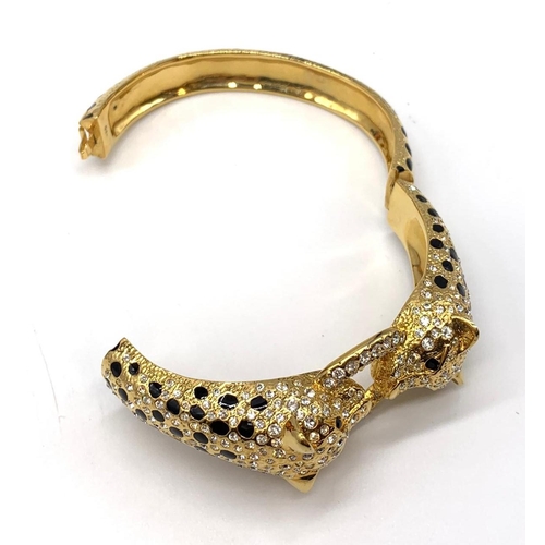 56 - A large silver (stamped 925) and gold plated bracelet in the Cartier style
Weight: 82g. In a present... 