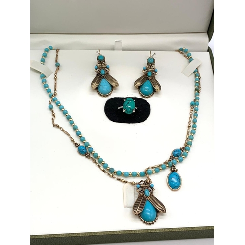 70 - An Egyptian revival set consisting of a double necklace, a matching pair
of earrings and a ring. In ... 