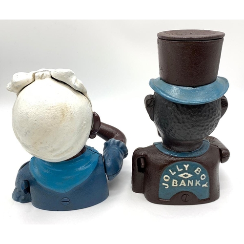 77 - A JOLLY BOY and AUNTIE JEMMA pair of cast iron money boxes with           
moving arms and eyes in e... 