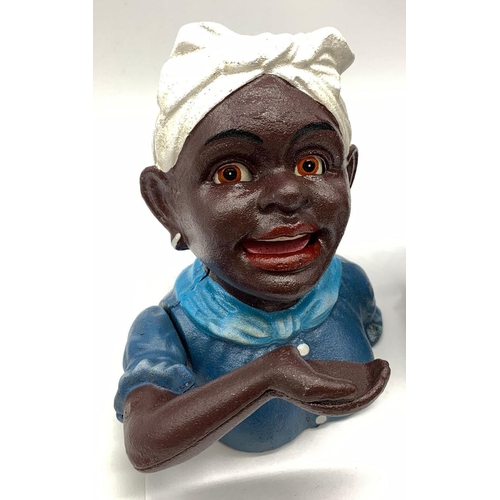 77 - A JOLLY BOY and AUNTIE JEMMA pair of cast iron money boxes with           
moving arms and eyes in e... 