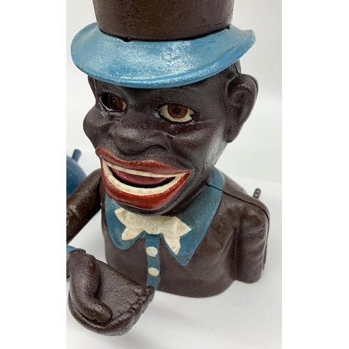 77 - A JOLLY BOY and AUNTIE JEMMA pair of cast iron money boxes with           
moving arms and eyes in e... 