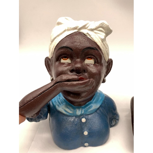 77 - A JOLLY BOY and AUNTIE JEMMA pair of cast iron money boxes with           
moving arms and eyes in e... 