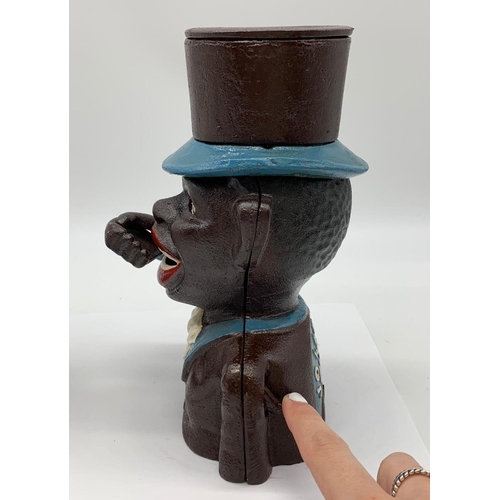 77 - A JOLLY BOY and AUNTIE JEMMA pair of cast iron money boxes with           
moving arms and eyes in e... 