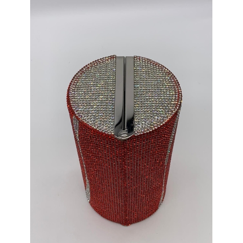 98 - A funky, evening bag designed in the style of a COCA COLA tin, totally
covered with Swarovski crysta... 