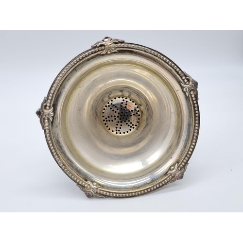 64 - Antique White Metal Wine Strainer Weight: 136.5g.
Height: 16cm