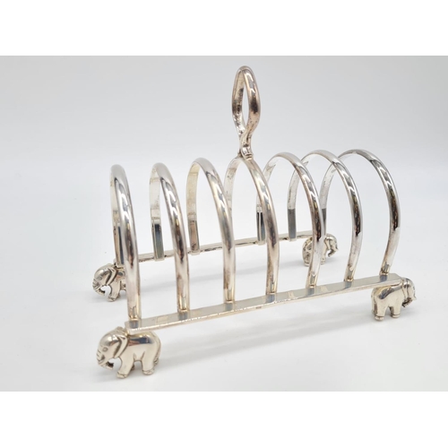 68 - White Metal Toast Rack with Elephant Feet Stand. 
Weight: 267g. Length:16cm