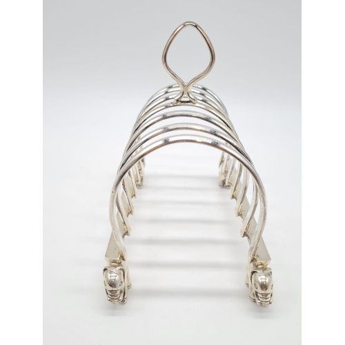 68 - White Metal Toast Rack with Elephant Feet Stand. 
Weight: 267g. Length:16cm