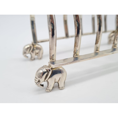 68 - White Metal Toast Rack with Elephant Feet Stand. 
Weight: 267g. Length:16cm