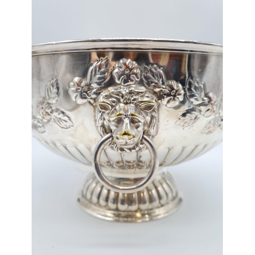 76 - Silver on Copper Punch Bowl with Lion Head Handle. Floral design. 26cm Diameter, 17cm Height. 1.45kg