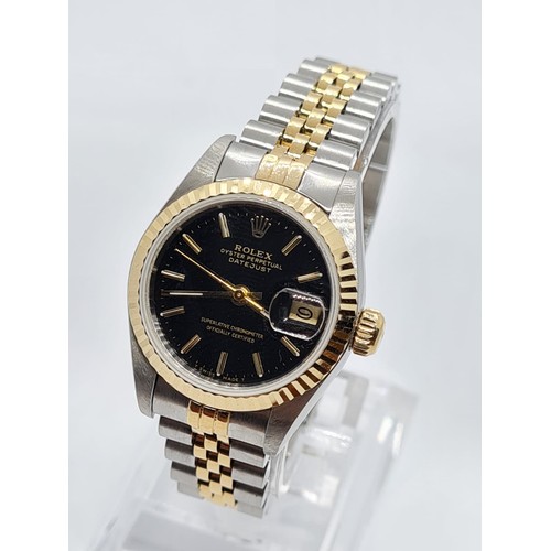 ROLEX Oyster Perpetual Datejust ladies watch with black face and