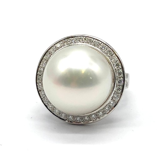 24 - A large Kimoto pearl (17mm diameter) ring set in diamond and 18ct white gold ring, weight 14.43g and... 