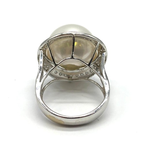 24 - A large Kimoto pearl (17mm diameter) ring set in diamond and 18ct white gold ring, weight 14.43g and... 