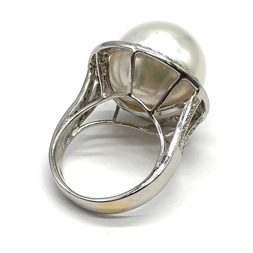 24 - A large Kimoto pearl (17mm diameter) ring set in diamond and 18ct white gold ring, weight 14.43g and... 