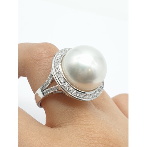 24 - A large Kimoto pearl (17mm diameter) ring set in diamond and 18ct white gold ring, weight 14.43g and... 