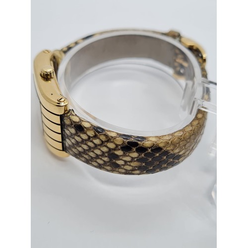 36 - 18ct gold ladies Boucheron watch, tank style with gold face and original Boucheron snake skin strap ... 