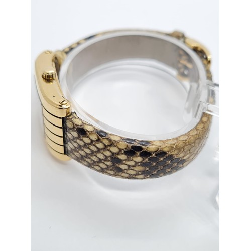 36 - 18ct gold ladies Boucheron watch, tank style with gold face and original Boucheron snake skin strap ... 