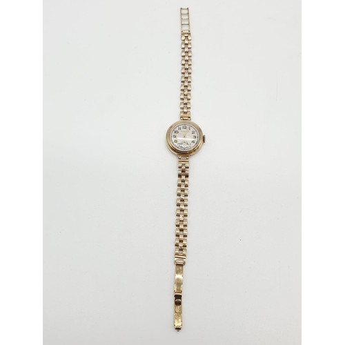 43 - 18ct gold Tudor vintage ladies watch, diamonds on each side of face, comes with safety chain and wor... 