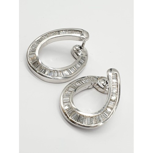 66 - Pair of large 18ct white gold and baguette cut diamond horse shoe earrings, weight 13.45g and 2.5cm ... 