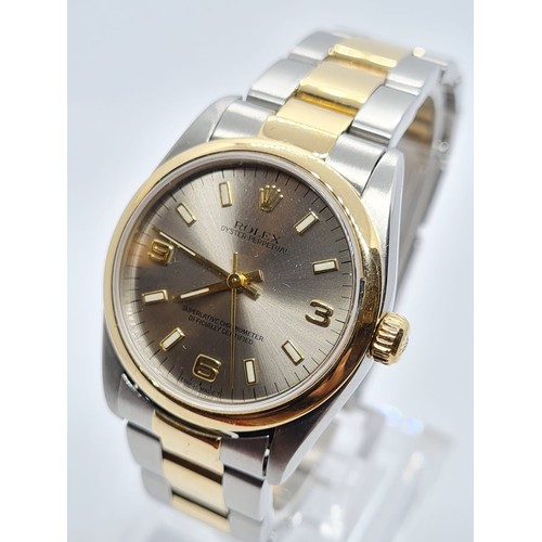 73 - Rolex Oyster Perpetual chronometer ladies watch with silver face and gold bezel,26mm case two tone s... 